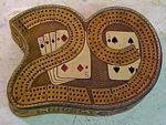 leather crbbage board, carved 29 cribbage board