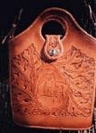 carved leather purse with horse and floral design