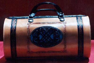 Back of large round leather travel bag